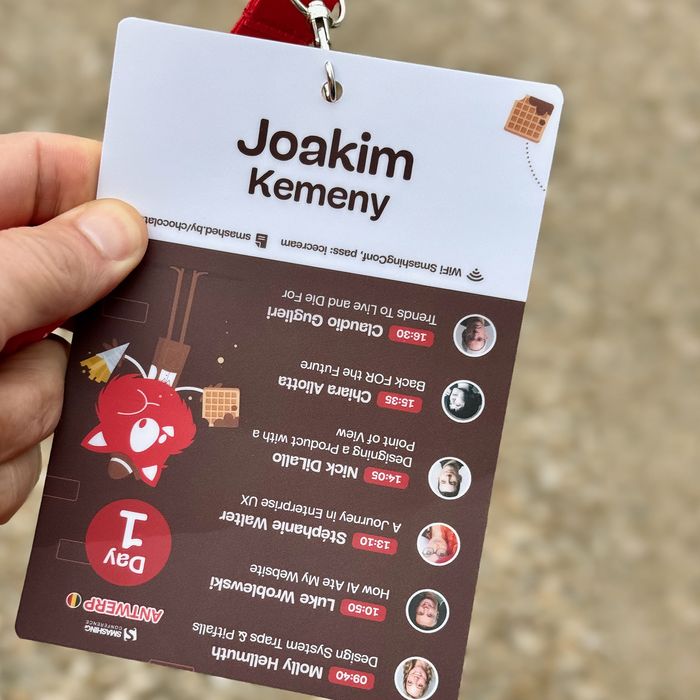 My attendee badge for SmashingConf with the program written upside down